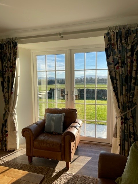 Quickslide's uPVC windows and doors contribute to the modernization of a holiday cottage near Kelso, Scotland, enhancing both style and functionality.