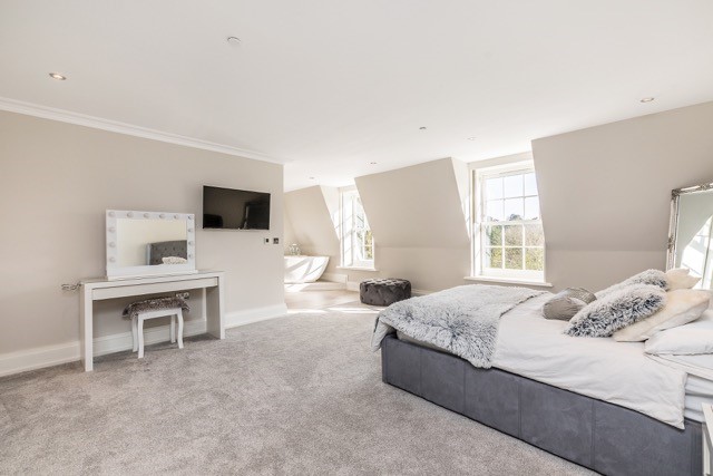White Georgian style uPVC sash windows in a bedroom