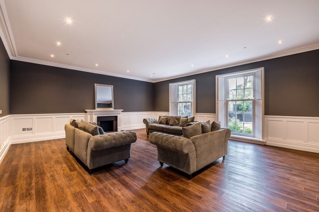 Two white Georgian uPVC sliding ash windows in a living room