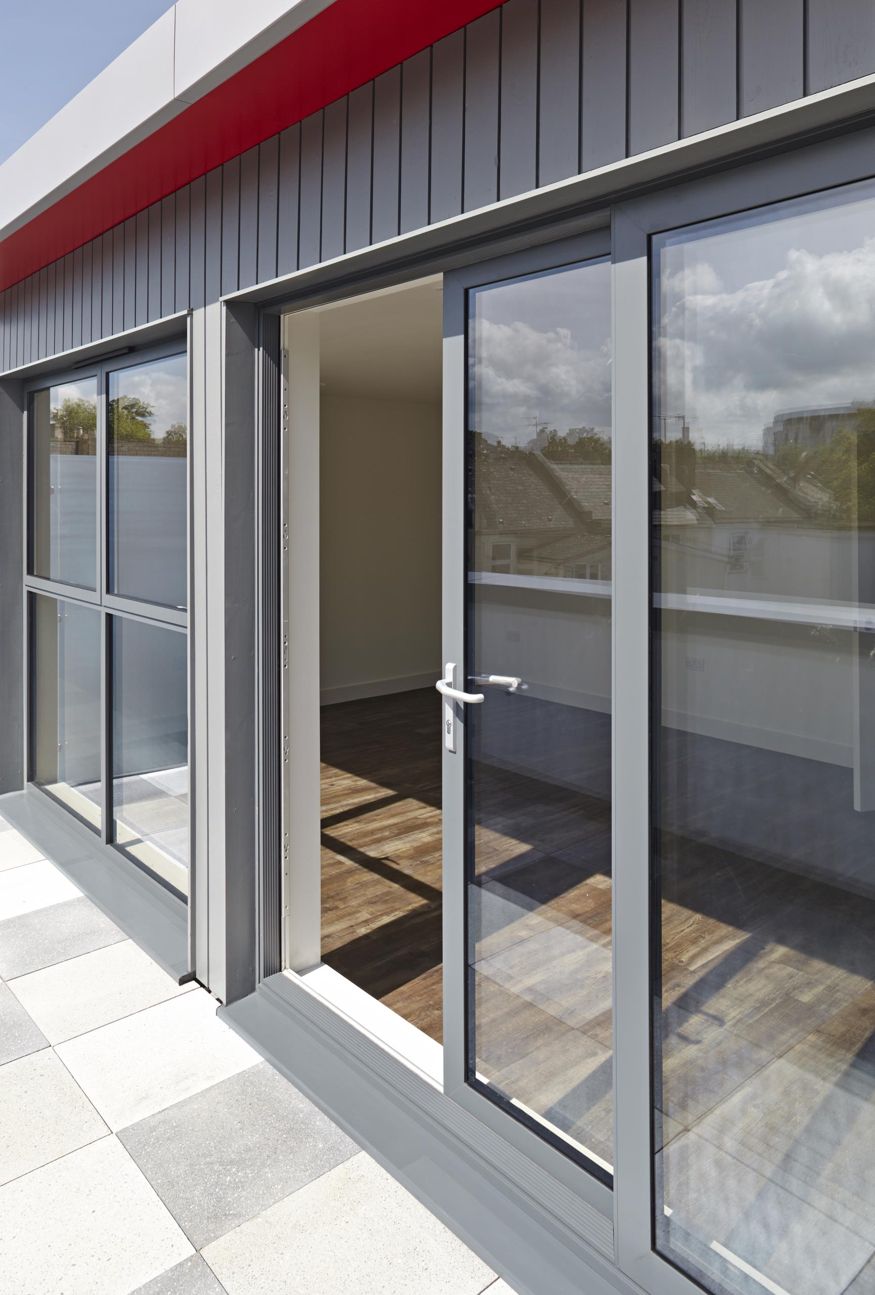 Grey aluminium sliding patio doors