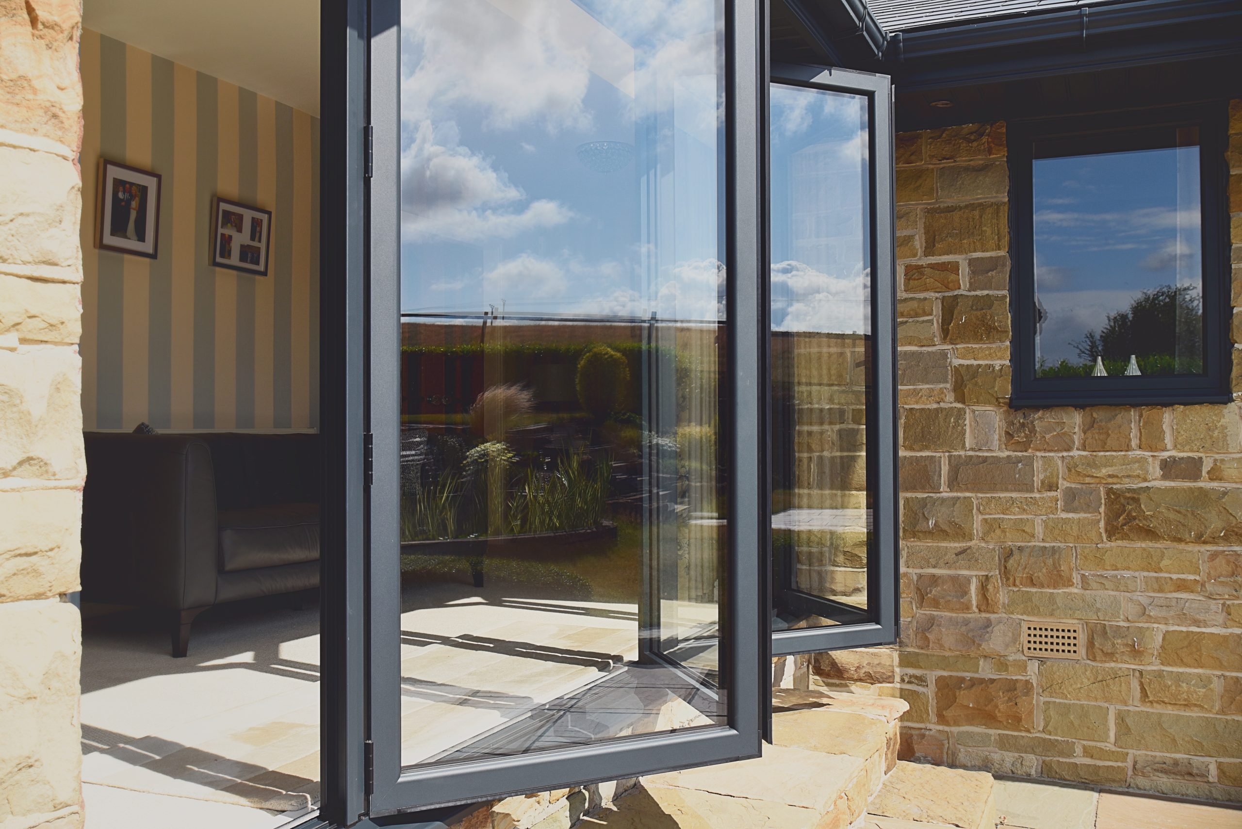 Wendy’s home in Brighouse transforms with Quickslide's aluminium bi-fold doors and casement windows, adding elegance.