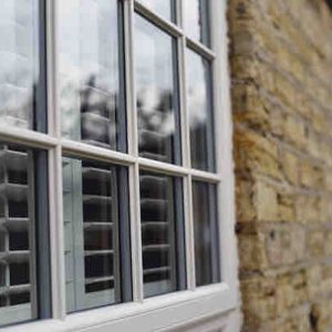 Close-up of uPVC window featuring traditional-style astragal bars for a classic appearance