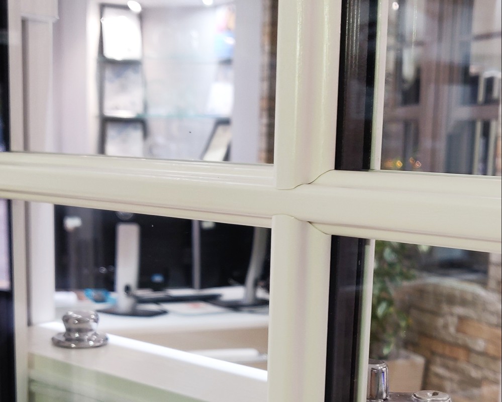 white upvc sash window astragal bars