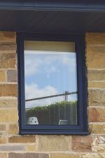 Close-up view highlighting the design and craftsmanship of an aluminium casement window
