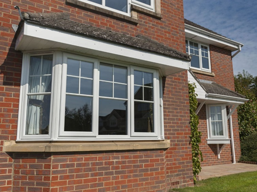 White uPVC Edwardian sash windows in a bay window