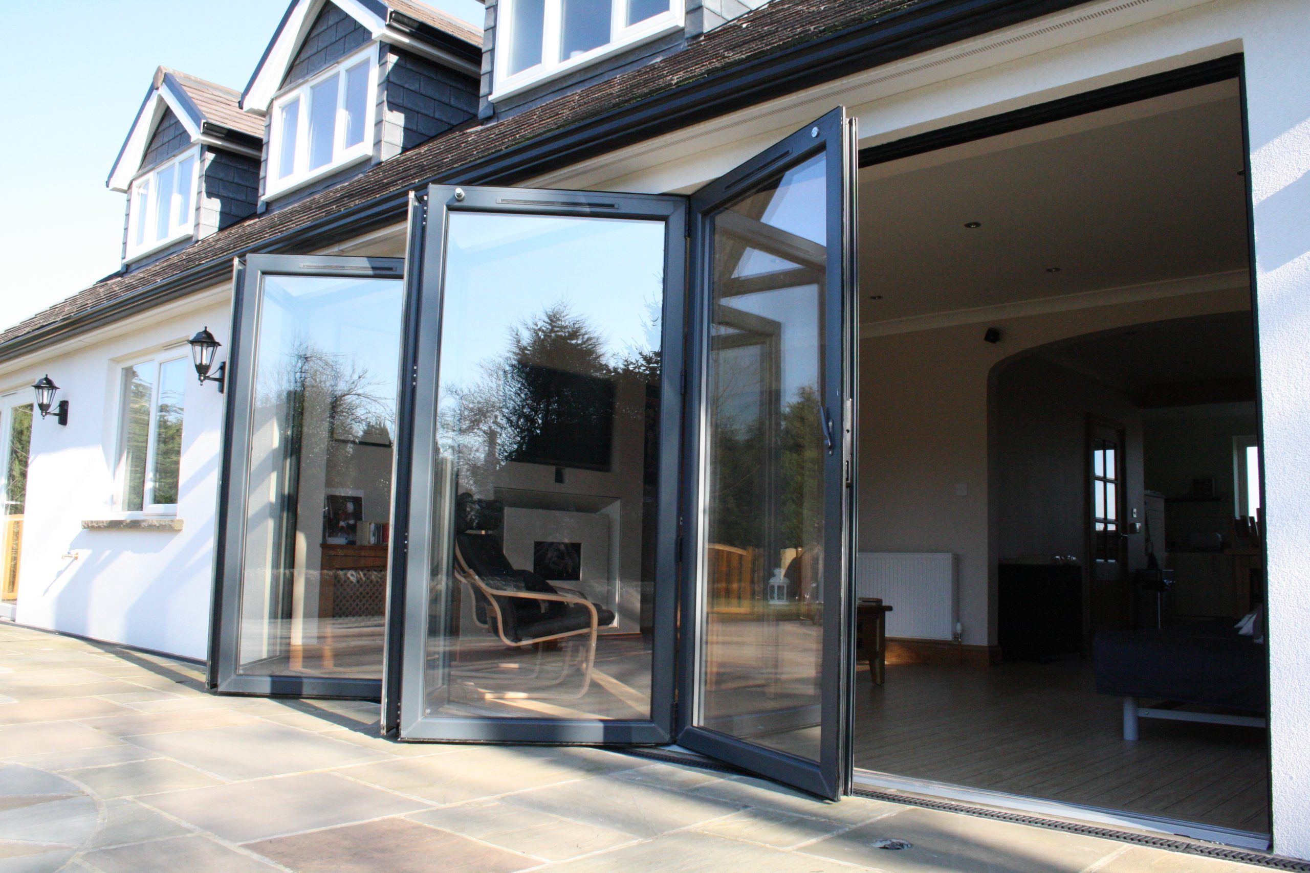 Aluminium Bifold Doors: Discover the benefits of aluminium bifold doors with this image showcasing their sleek design and functionality. Explore why aluminium bifold doors are a popular choice for modern homes.