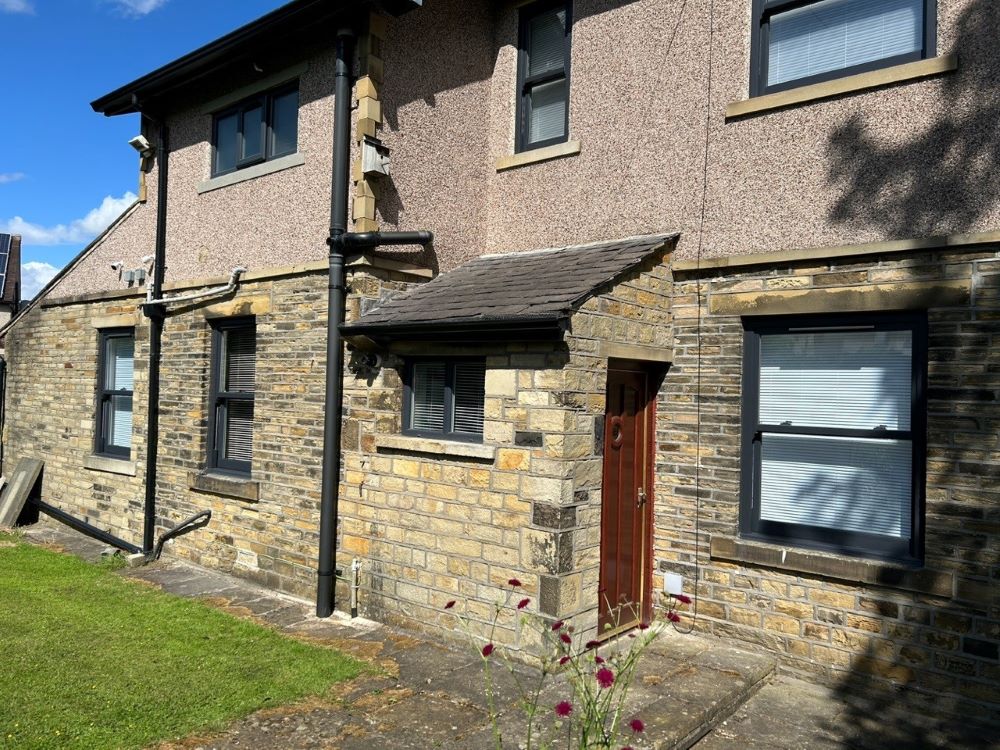 Sleek anthracite grey sash windows add urban sophistication to stylish modern homes.