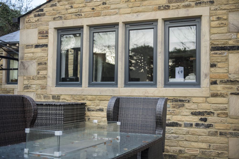 Anthracite grey sash windows blend classic and modern design, revitalizing traditional facades.