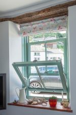 Chartwell green uPVC sliding sash window