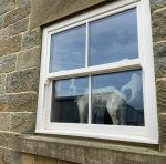 Elegant cream grain sliding sash windows, combining traditional charm with modern performance