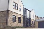 Stylish grey sliding sash windows featured in one of our projects, enhancing modern aesthetics and functionality