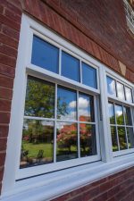Classic white sliding uPVC sash windows, offering a clean look and excellent energy efficiency