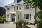 Contemporary white grain sliding sash windows, offering a timeless look and smooth operation