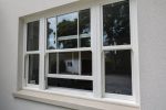 Elegant white grain sliding sash windows, combining style and modern functionality.