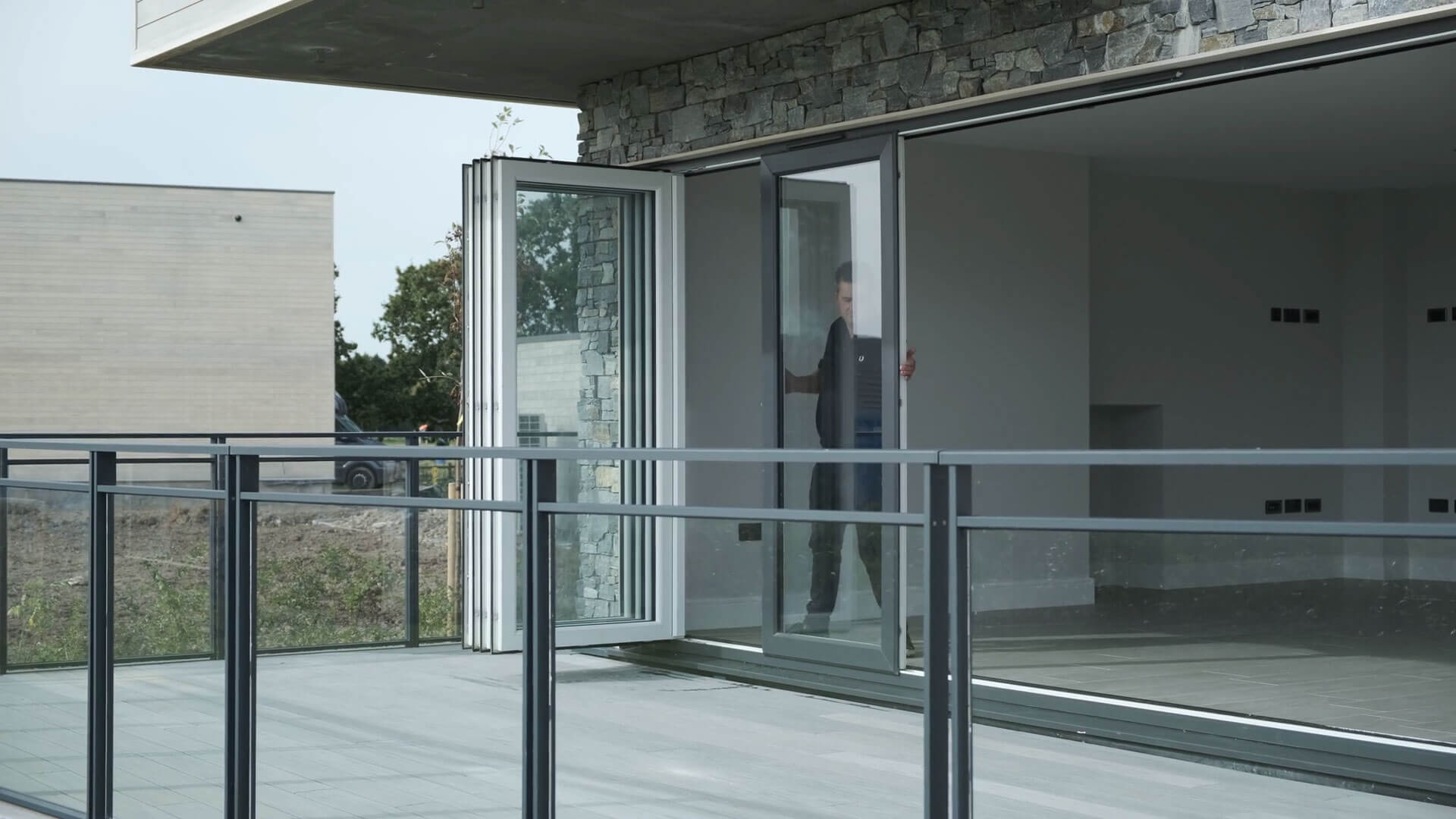 An image of slide-and-turn doors with flexible, individually folding panels.