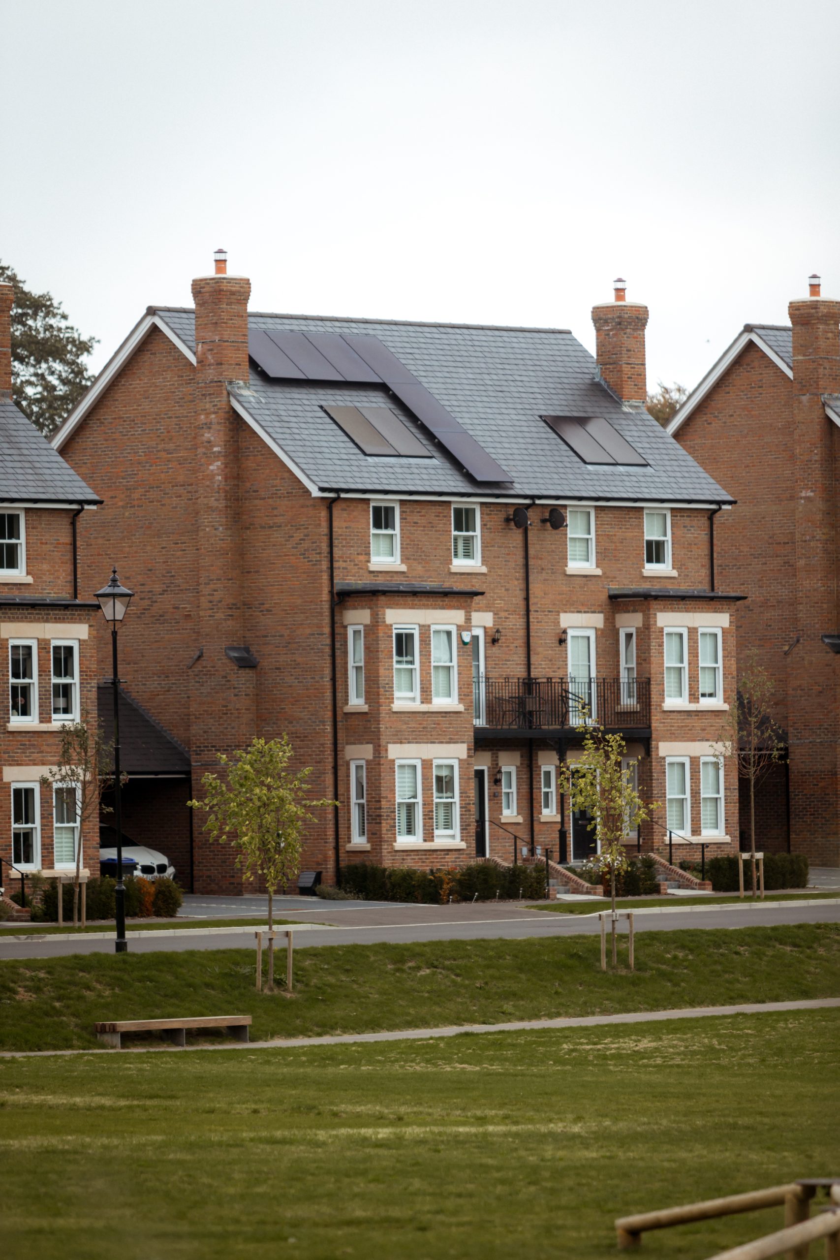 Vertical slider windows in smooth white uPVC, supplied by Quickslide for King’s Weald project