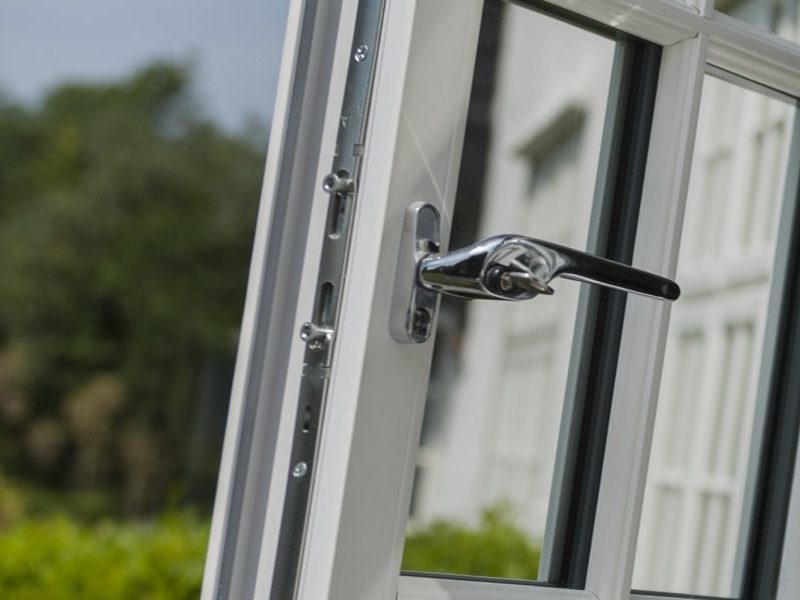 Detailed view of the multi-point locking system on a uPVC window, designed for enhanced security