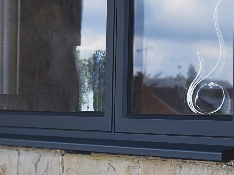 Detailed view of the smooth, flush external contours of an aluminium casement window