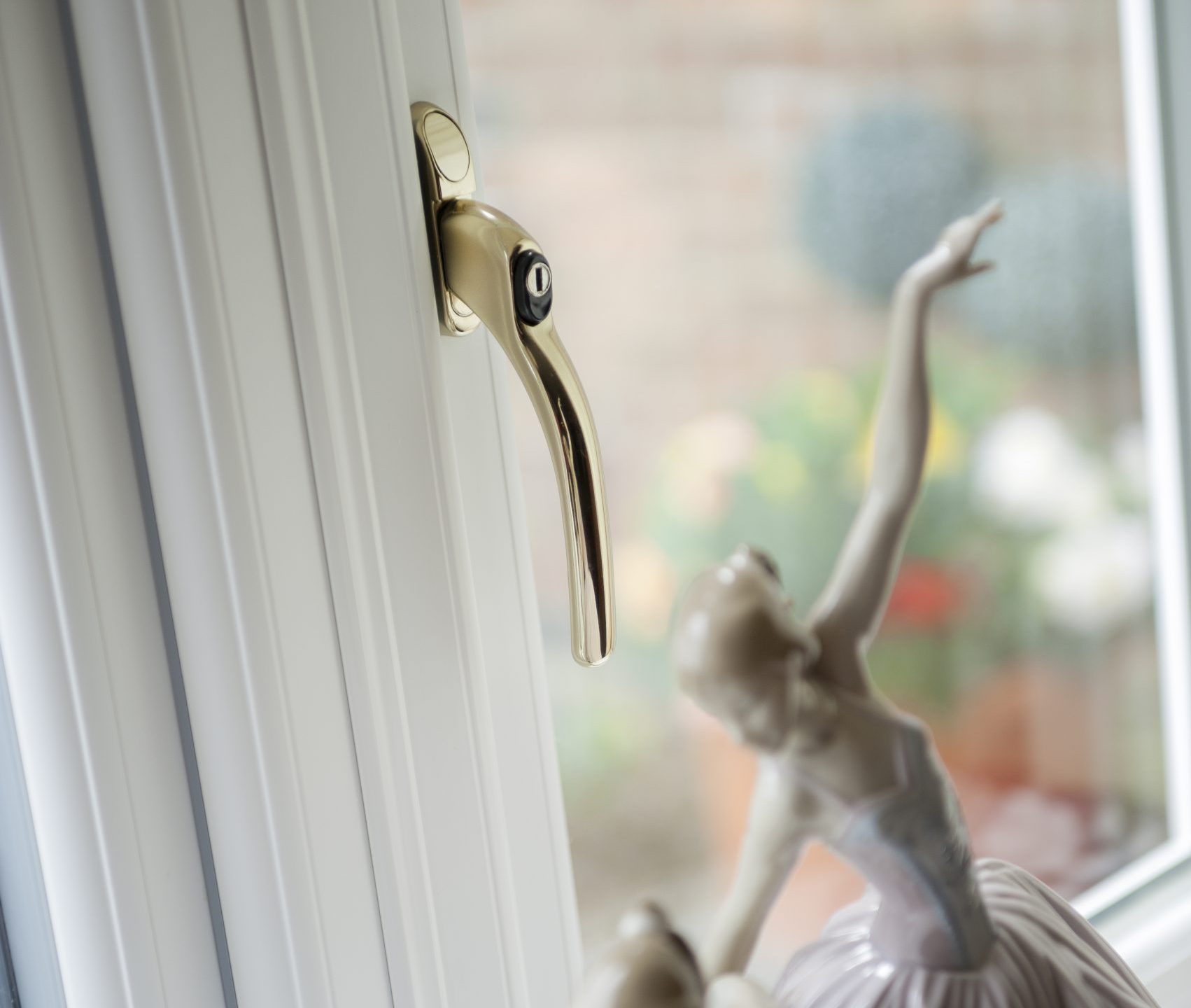 Close-up of a single uPVC window handle in one finish, complementing the window style