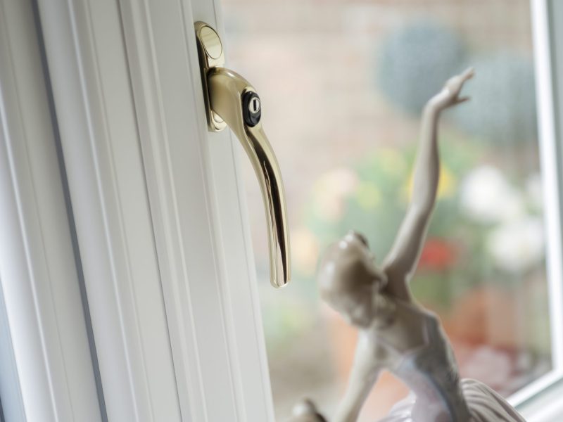 Close-up of a single uPVC window handle in one finish, complementing the window style