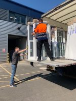 uPVC vertical sash windows displayed with the Quickslide delivery team, showcasing availability across various UK cities.