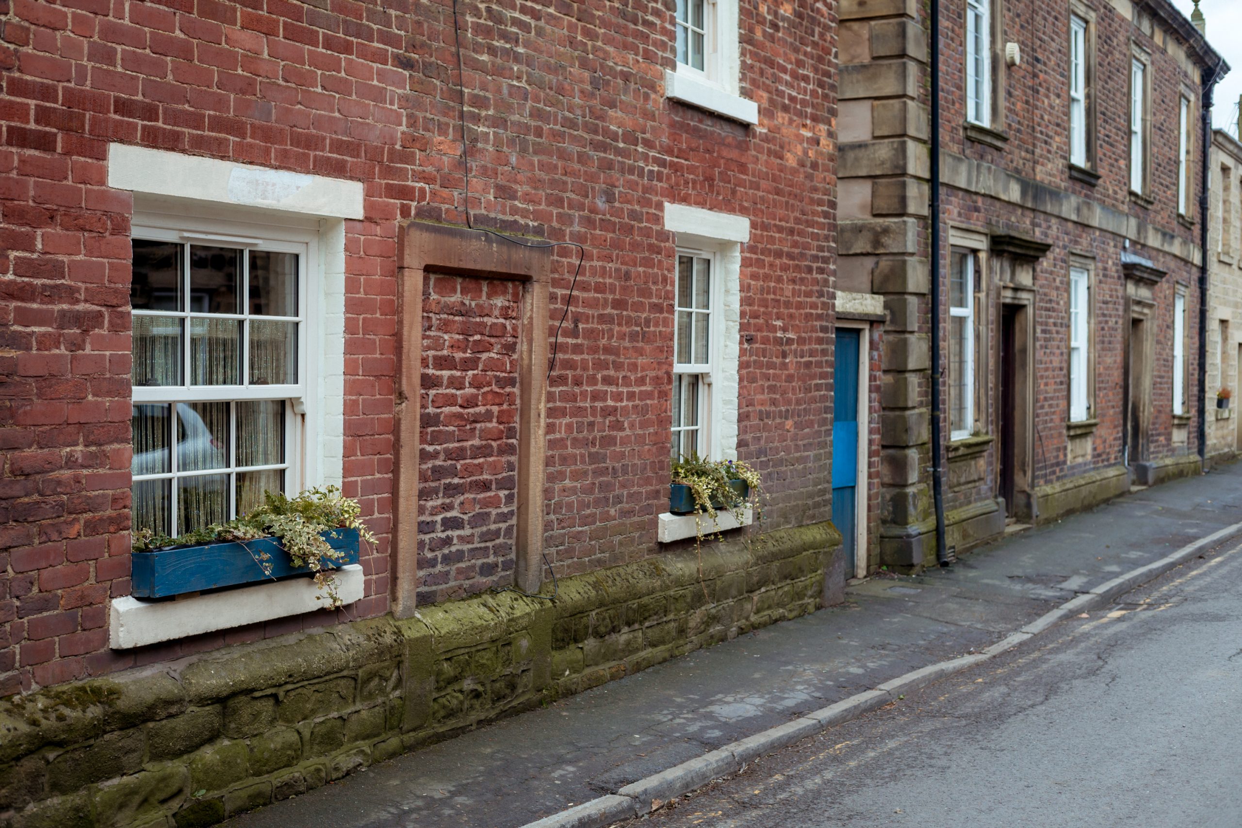 Traditional windows blending with energy-efficient modern glazing.
