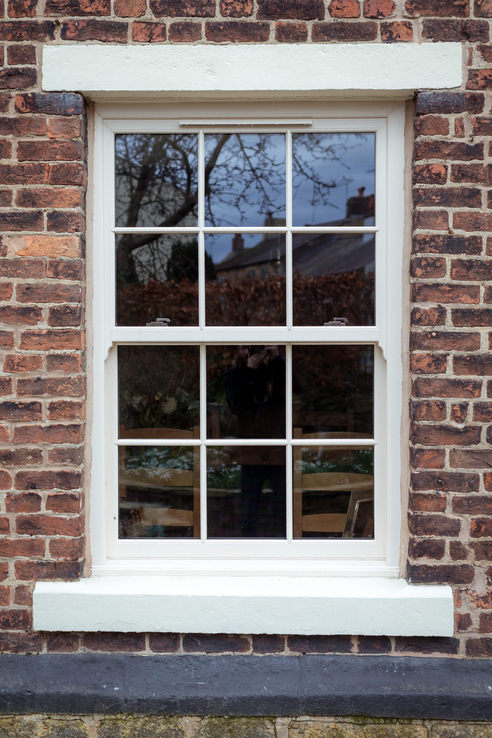 Cream sash window with ovolo detailing for symmetrical period styling