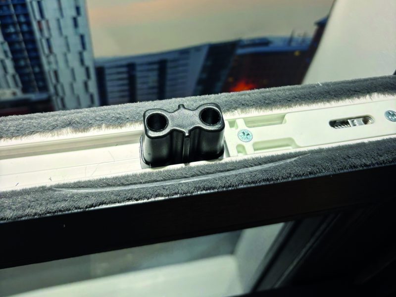 Detailed view of top sash security bolts providing added security to sliding sash windows