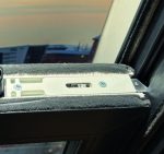 Close-up of reinforced metal tilt latches designed for secure and smooth sash tilting