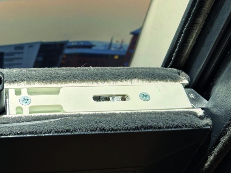 Close-up of reinforced metal tilt latches designed for secure and smooth sash tilting