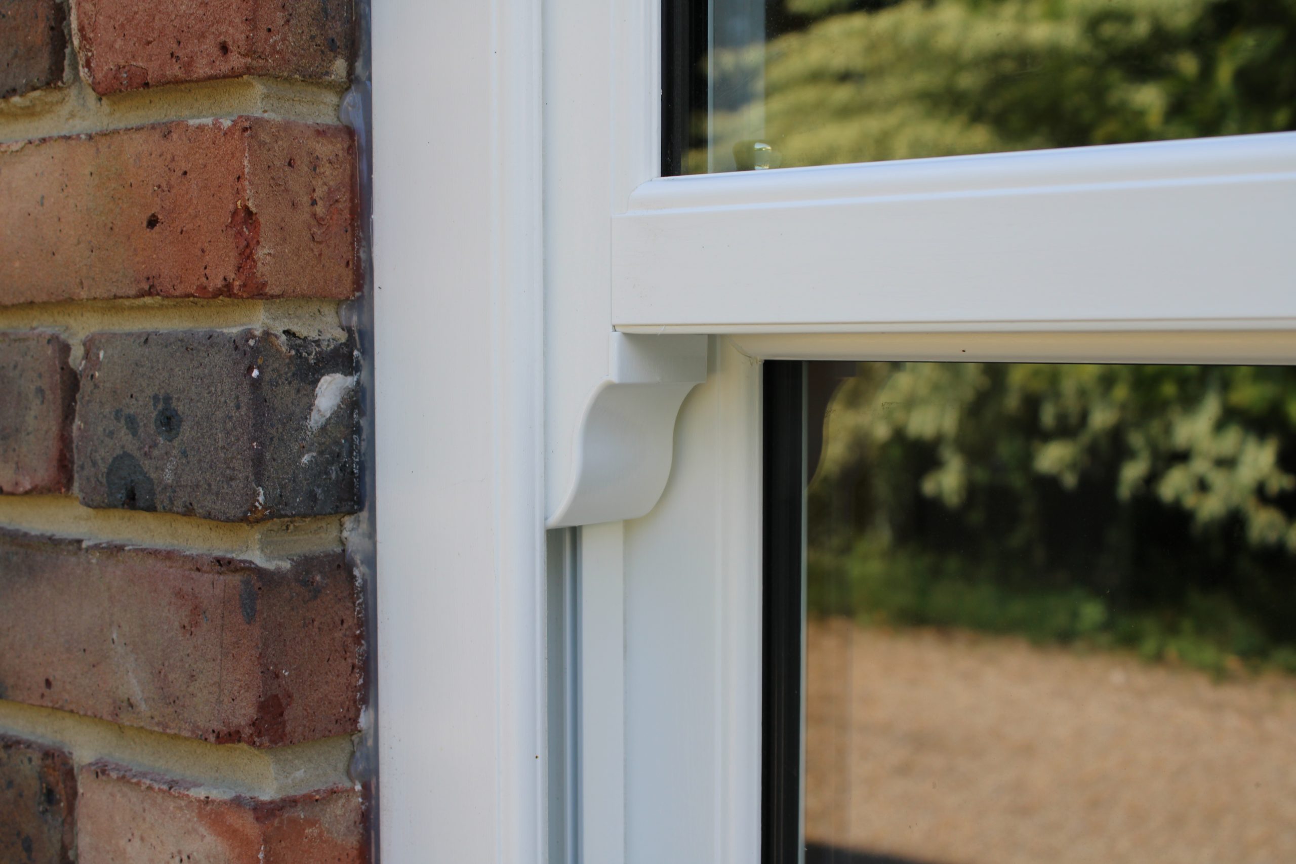 Detail of sash window with run-through horns for a traditional aesthetic
