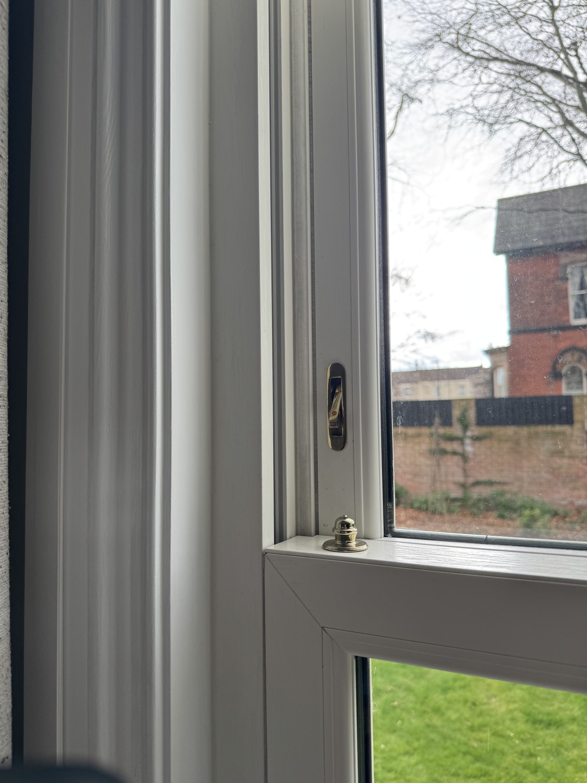 Close-up of Quickslide Legacy sash window with run-through sash horns
