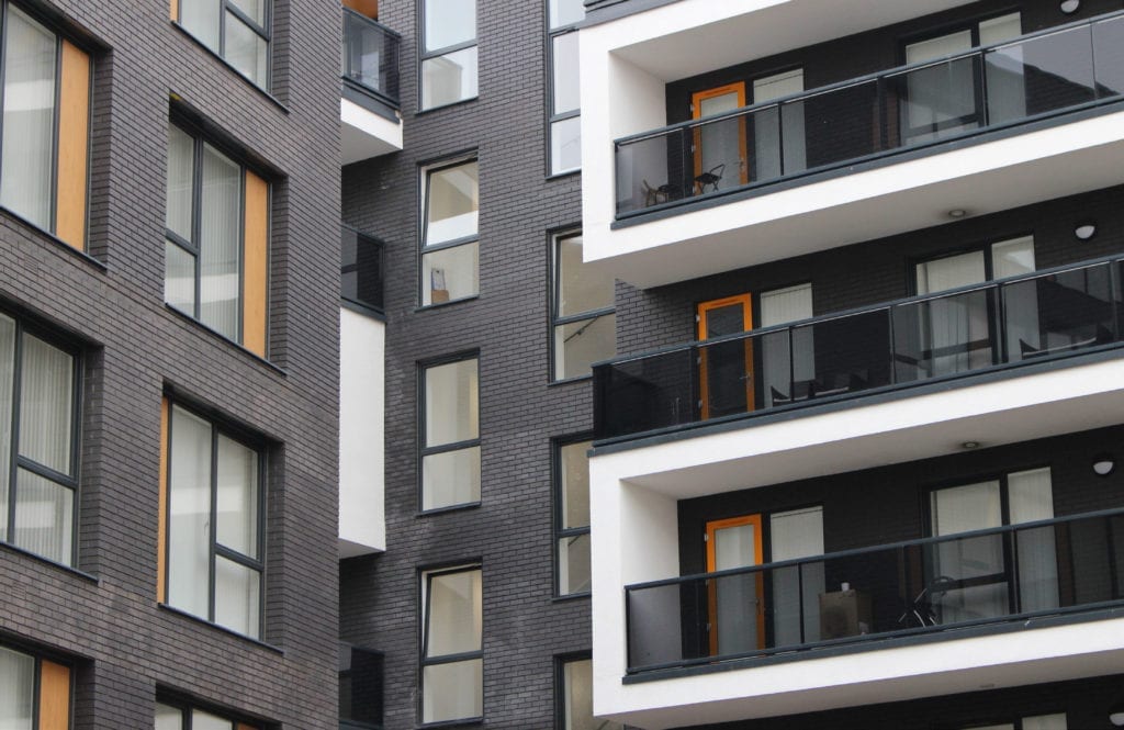 modern tilt and turn windows in black on a modern apartment building