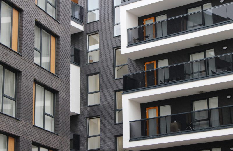 Contemporary apartment block with aluminium windows and glass balconies
