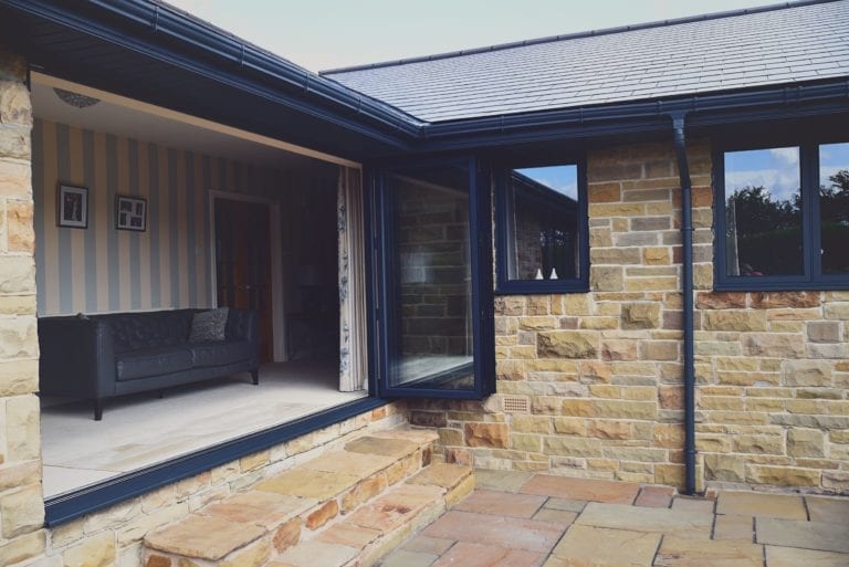Opened Black Aluminium Bifold Doors