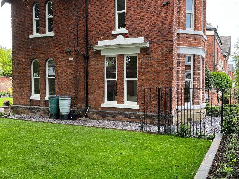Arched white sliding sash windows