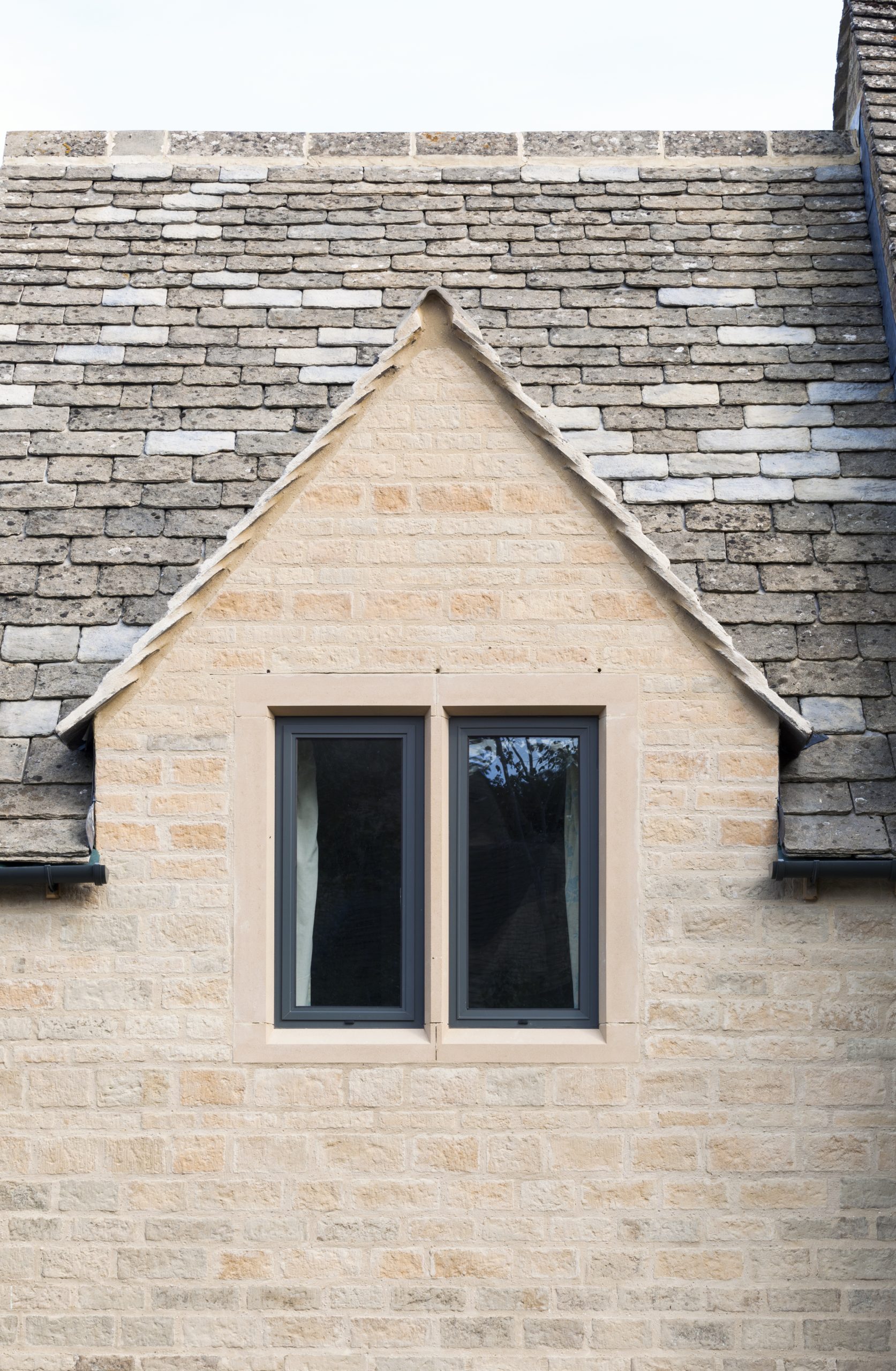 Aluminium heritage window frame fitting seamlessly into a traditional home design