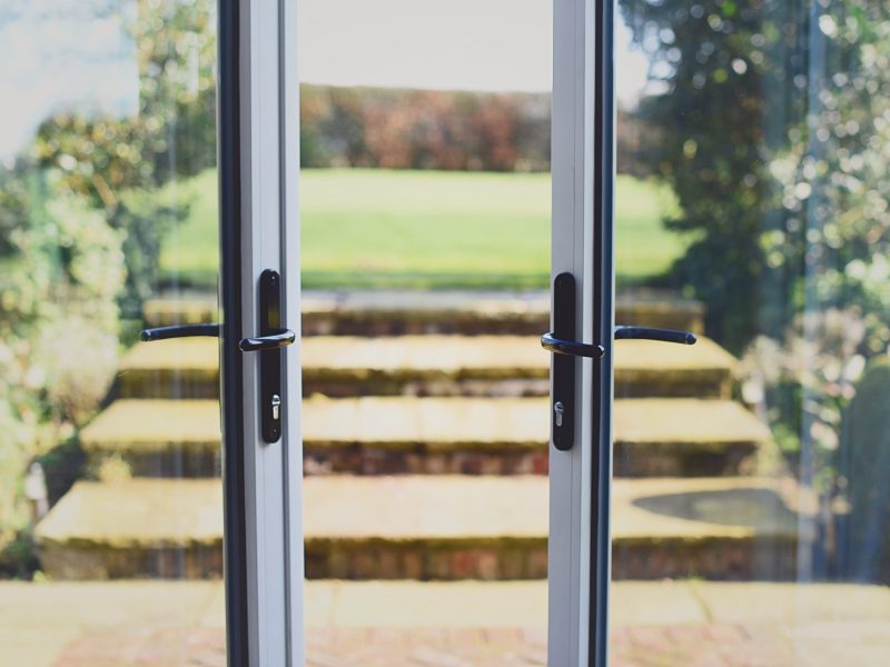 Stylish handles and secure hardware for aluminium French doors, including locking systems and hinges