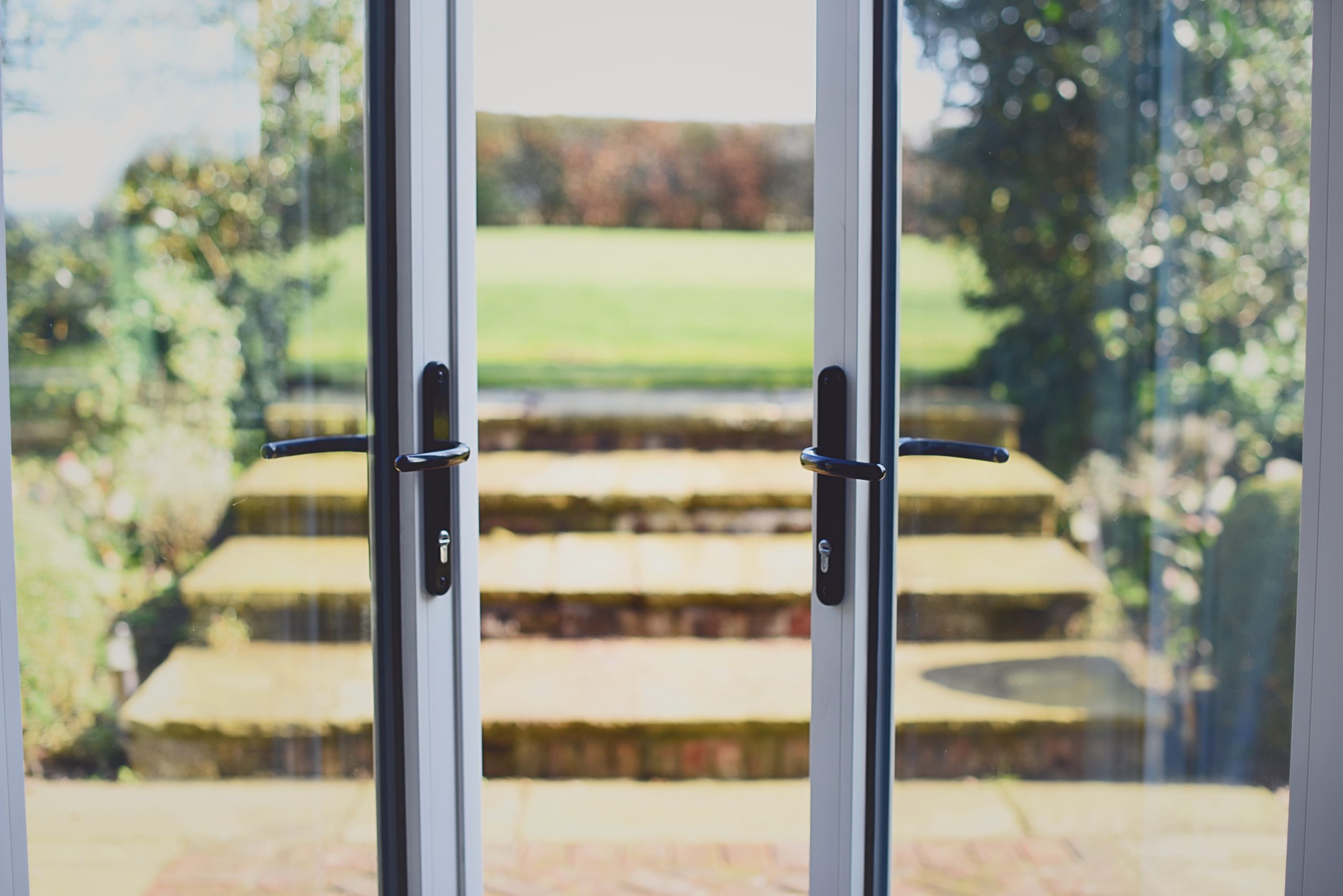 Stylish handles and secure hardware for aluminium French doors, including locking systems and hinges