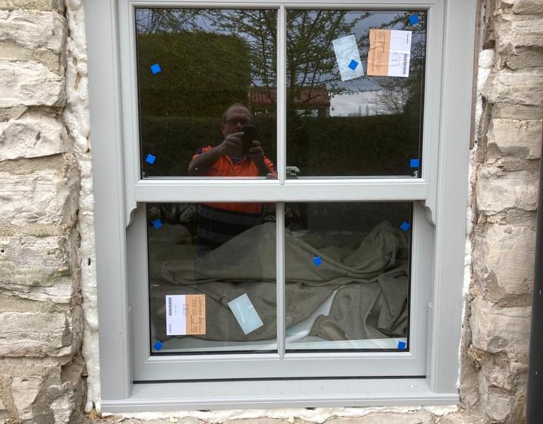 Grey Woodgrain Sliding Sash Windows