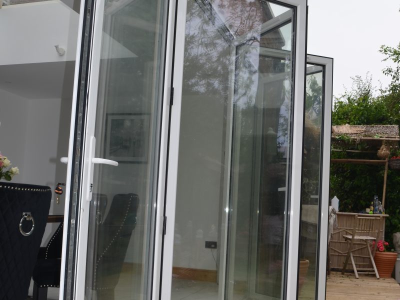 White aluminium bifold doors with trickle vents
