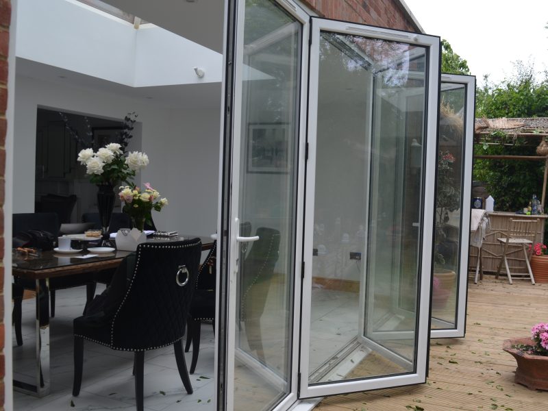 White aluminium bifold doors with trickle vents