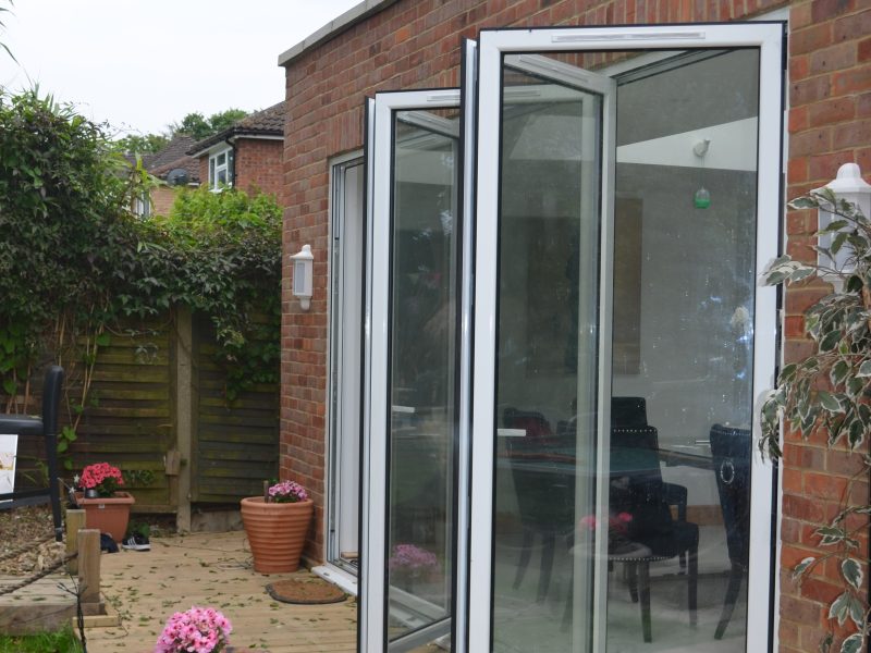 White aluminium bifold doors with trickle vents