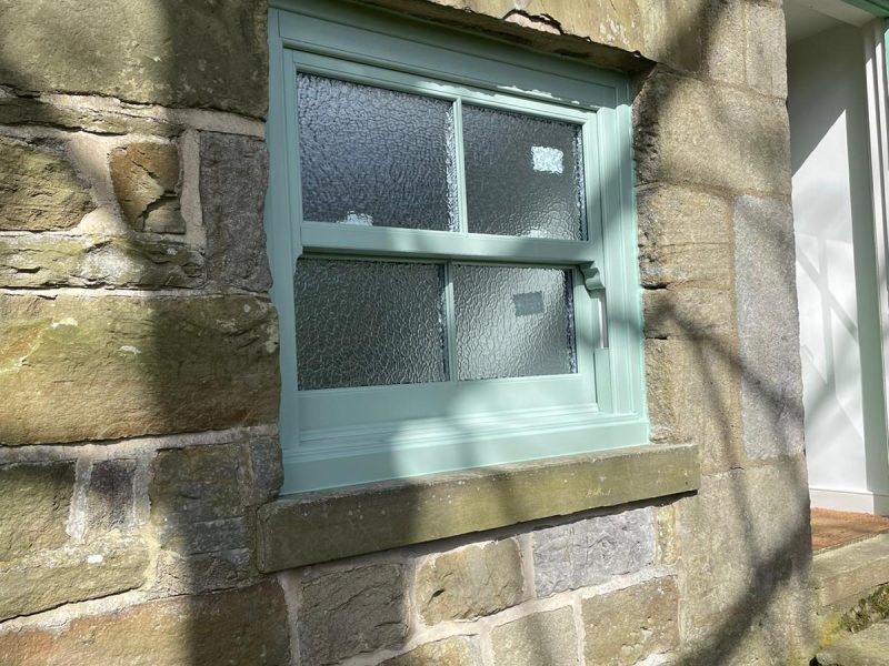 Chartwell Green frosted glass sliding windows