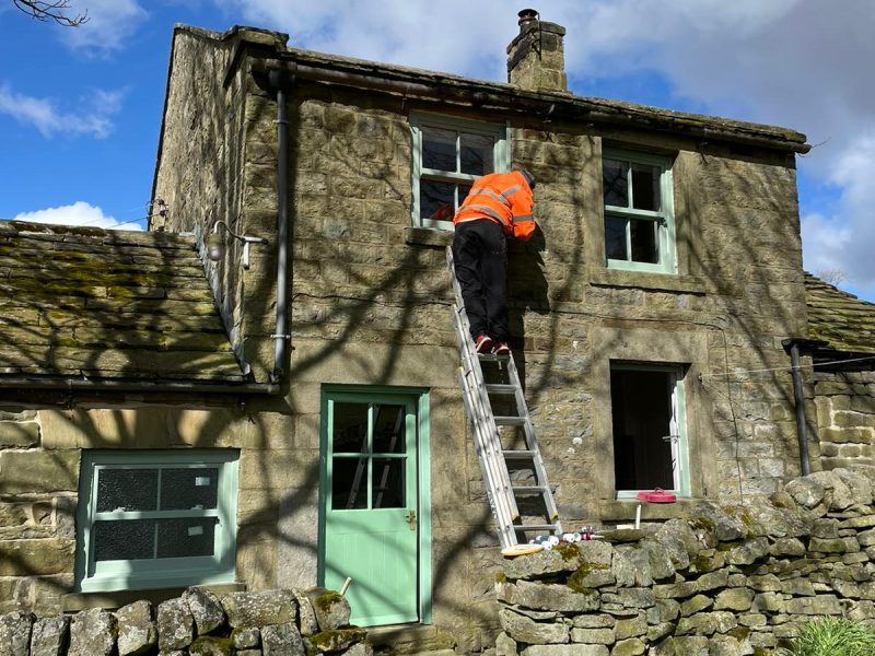 Chartwell Green Wood effect sliding windows