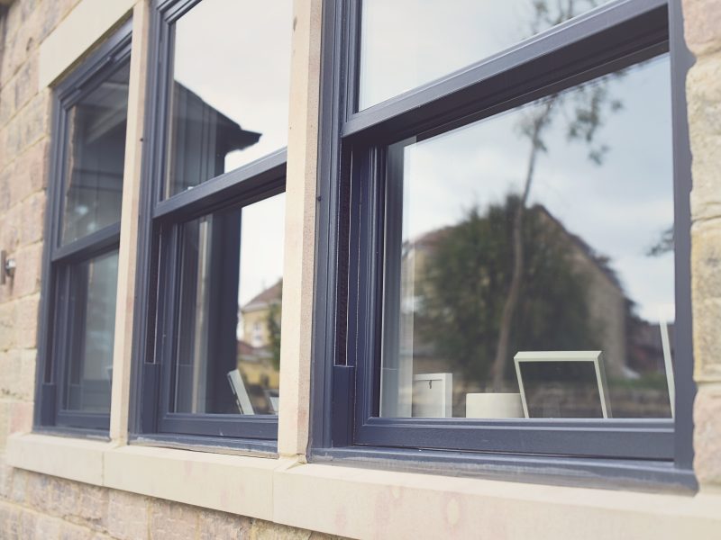 Grey woodgrain sliding sash windows