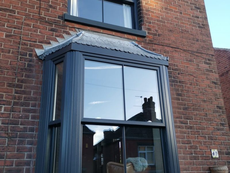 Black woodgrain sliding sash windows