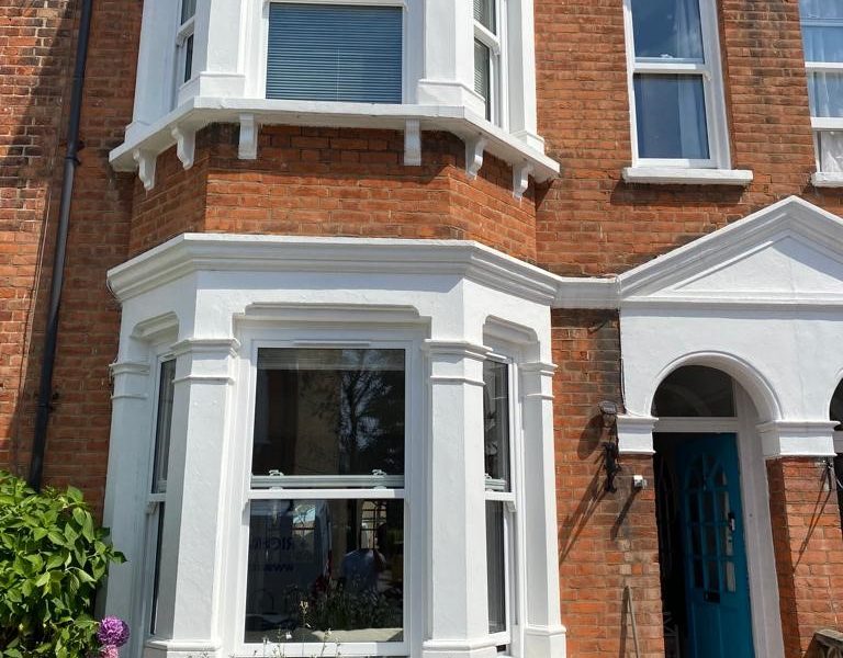 Traditional white bay windows
