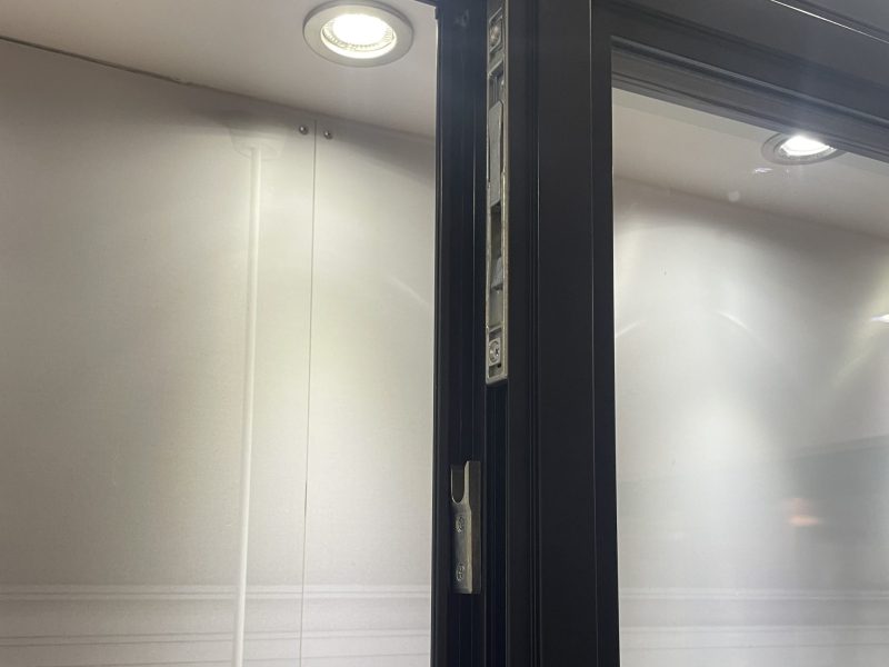 Close-up of a multi-point locking mechanism on an aluminium heritage door for added protection