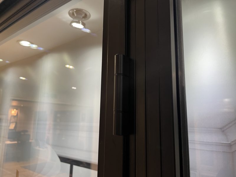 Matte black hinge detail on an aluminium heritage door for a sleek, classic finish